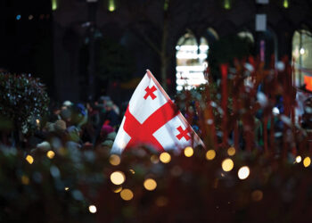 The Georgian flag at a peaceful protest. Image source: Reuters