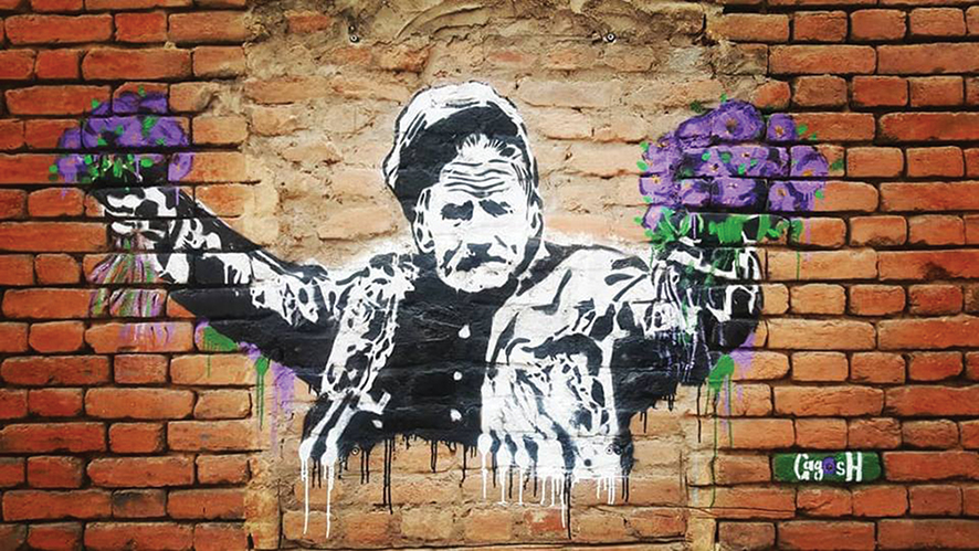 Photo: Gagosh’s street art of the old man selling violets on a Janashia Street wall, Tbilisi.