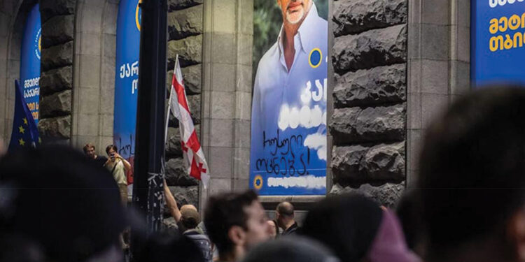 The phrase ‘Russian Dream’ is shown written on one of Kakha Kaladze’s election posters on Melikishvili Avenue. Photo by Mariam Nikuradze/OC Media