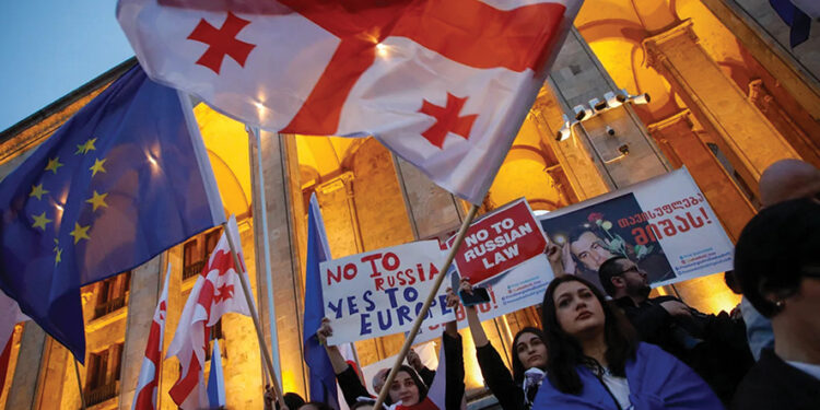 Protesters in front of Georgia's parliament building at a rally in Tbilisi in 2024. Photo by David Mdzinarishvili/EPA-EFE