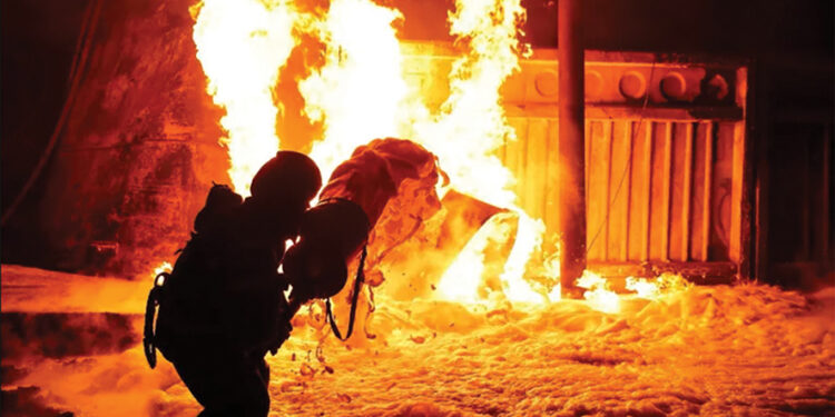 A firefighter works at the site where a critical infrastructure facility was hit by Russian drone strikes in Ukraine. Source: Reuters