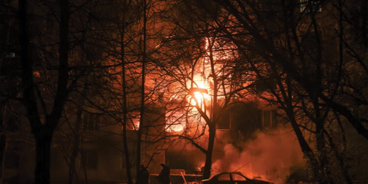 Firefighters work at the site of a burning apartment building which was damaged during an evening Russian drone strike, in Zaporizhzhia, Ukraine, on November 25. Source: Reuters