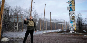 Ukraine's President Volodymyr Zelensky self-records a video in front of a sign that reads 'Kupiansk.' Source: Ukrainian Presidential Press Service/Handout via REUTERS