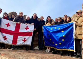 Youth groups display Georgian and EU flags at Narikala for State Flag Day