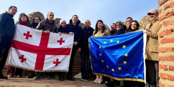 Youth groups display Georgian and EU flags at Narikala for State Flag Day