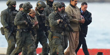 Nicolas Maduro and his wife, Cilia Flores, in handcuffs after landing in Manhattan, New York, on January 5. Photo by XNY/Star Max/GC Images