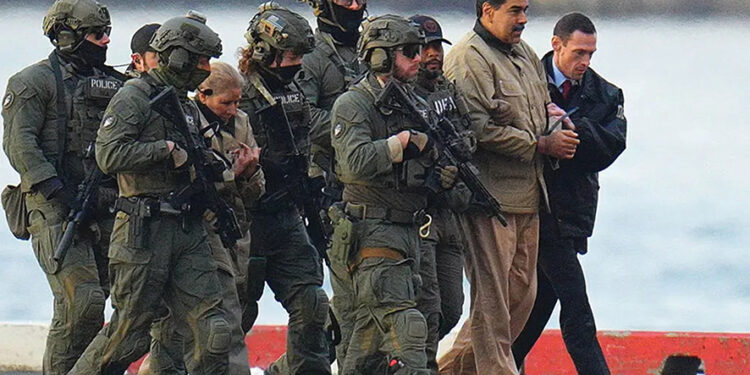 Nicolas Maduro and his wife, Cilia Flores, in handcuffs after landing in Manhattan, New York, on January 5. Photo by XNY/Star Max/GC Images