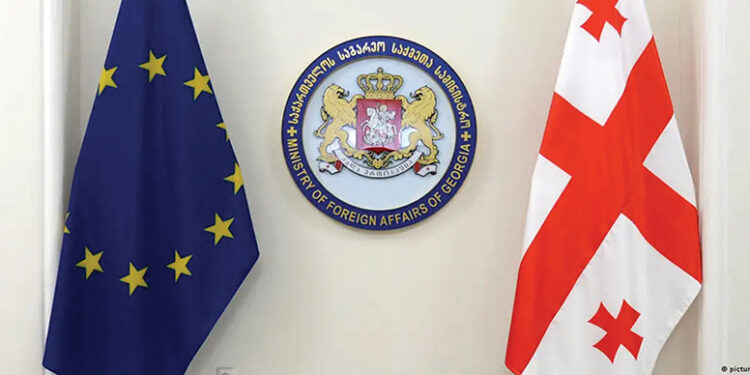 The EU and Georgian flags. Source: dw