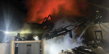 Emergency services personnel work to extinguish a fire after a Russian air attack in Bohodukhiv, Kharkiv region. Source: Ukrainian Emergency Service via AP