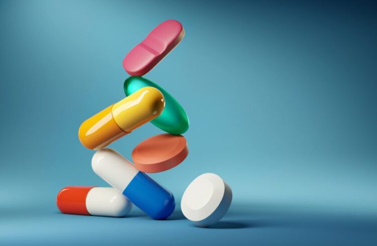 Colorful pills against blue backdrop. Photo: MedShadow Foundation.
