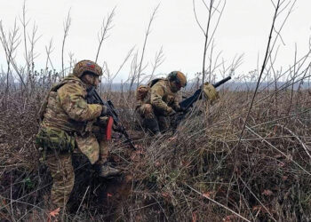 Russian soldiers prepare to fire a grenade towards Ukrainian positions. Source: Russian Defense Ministry Press Service via AP