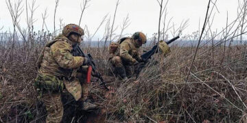 Russian soldiers prepare to fire a grenade towards Ukrainian positions. Source: Russian Defense Ministry Press Service via AP