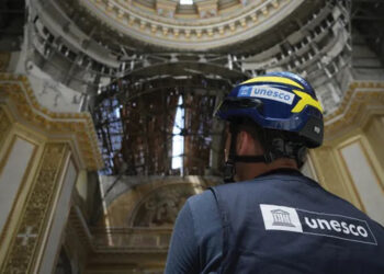 A UNESCO inspector checking damage in Ukraine. Source: UNESCO