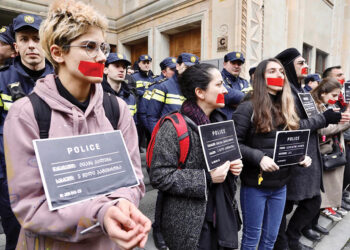 Activists protesting the draft law that would label CSOs and media receiving foreign funding as "foreign agents," March 2023. Photo by Guram Muradovi/Civil.ge