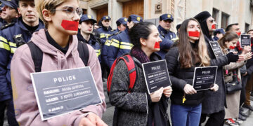 Activists protesting the draft law that would label CSOs and media receiving foreign funding as "foreign agents," March 2023. Photo by Guram Muradovi/Civil.ge