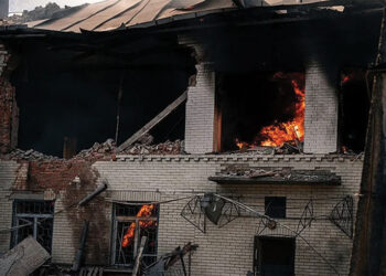 A kindergarten building burns after a Russian drone strike in Sumy, where a woman was killed and two other people were injured. Source: rte