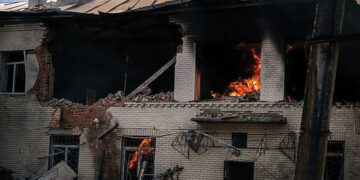 A kindergarten building burns after a Russian drone strike in Sumy, where a woman was killed and two other people were injured. Source: rte