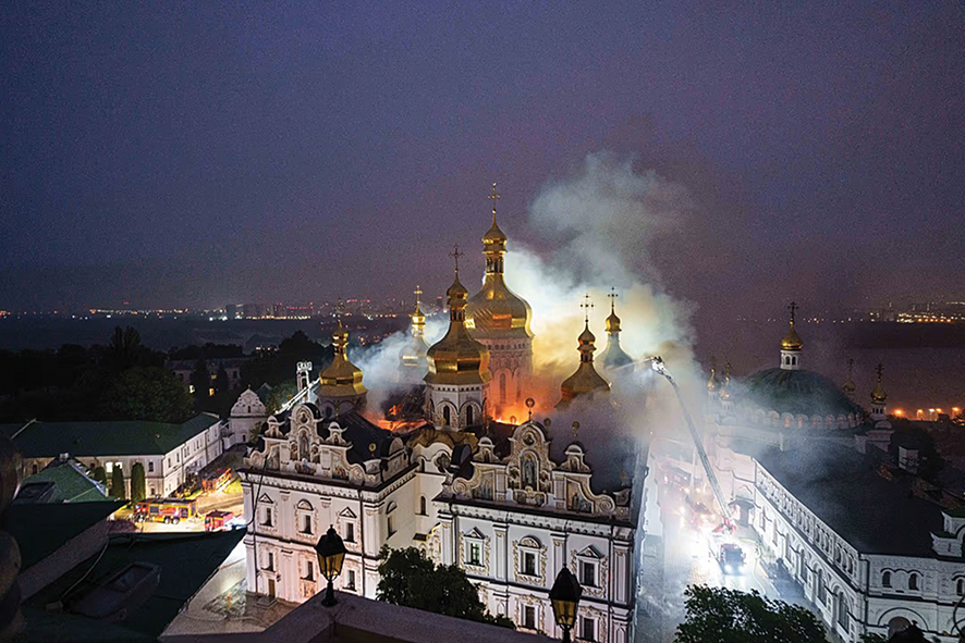 Rescue workers try to put out a fire at the Kyiv Pechersk Lavra. Source: AP