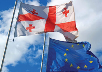 The Georgian and EU flags. Source: emerging-europe