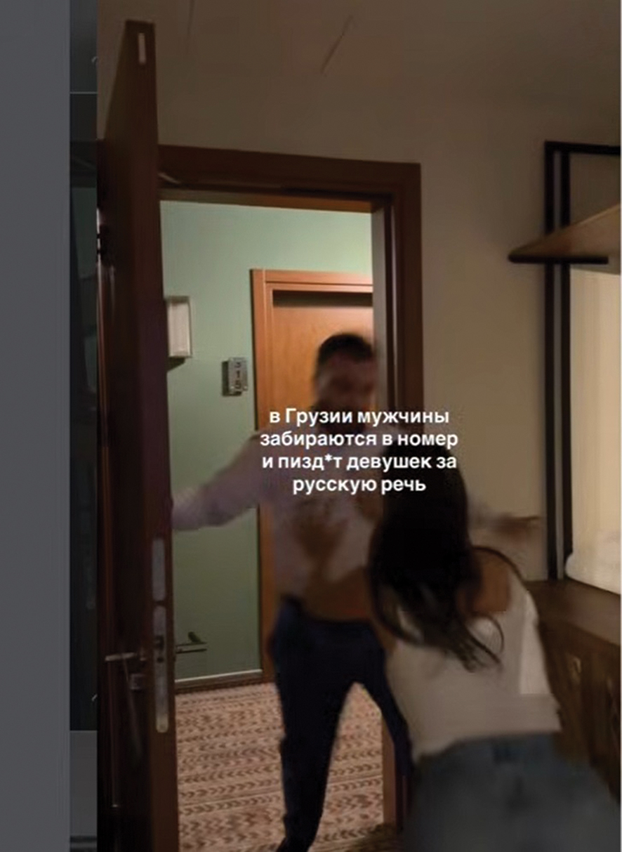 Russian woman pushes Chighladze out of her room. Source: IG